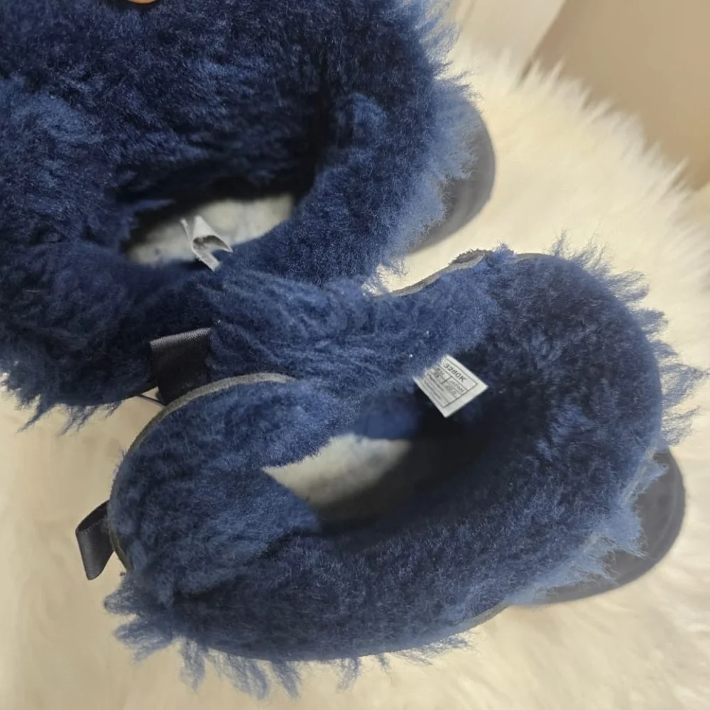 UGG Kid’s Bailey Bow II boots in a navy blue suede